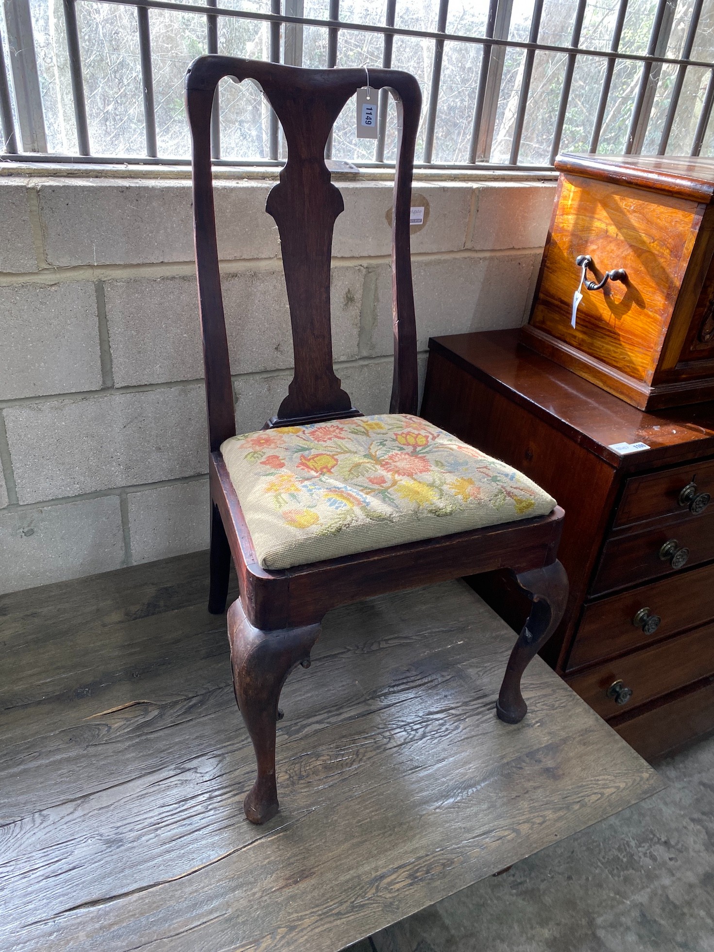 A pair of 18th century oak and walnut dining chairs